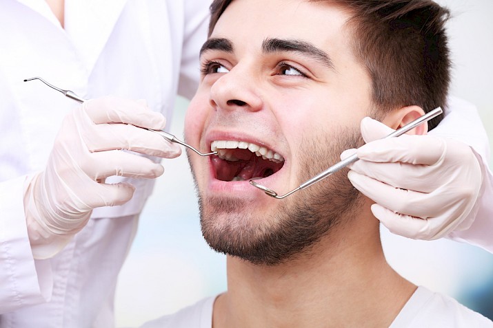 Man getting a root canal treatment.